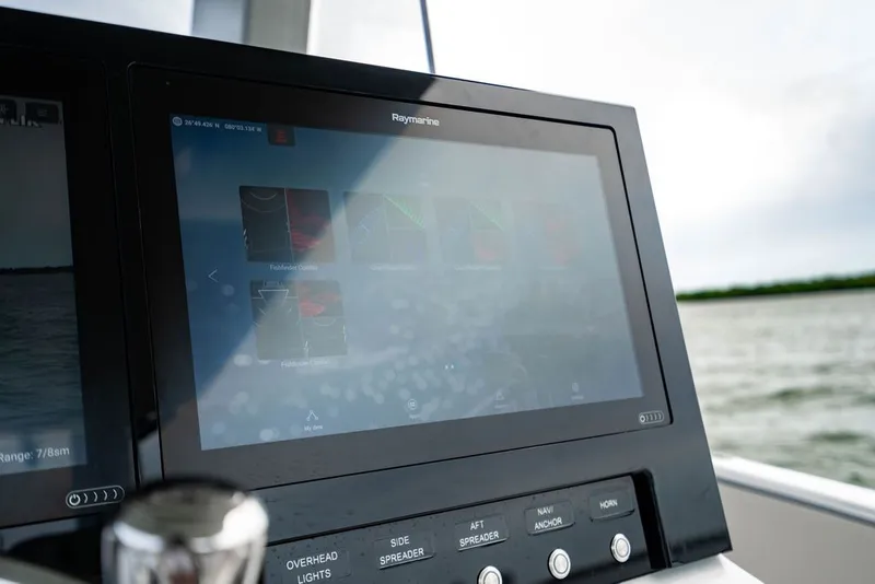 Slide: The Image of Control console with touchscreen and buttons, view of water in the background. - 22