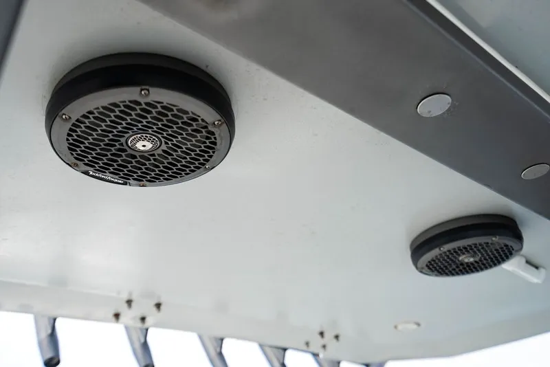Slide: The Image of Speakers mounted on the ceiling of a boat, likely part of an audio system. - 29