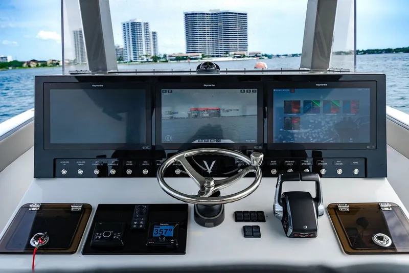 Slide: The Image of Dashboard of a 2021 Custom 368 Center Console with multiple screens. - 30