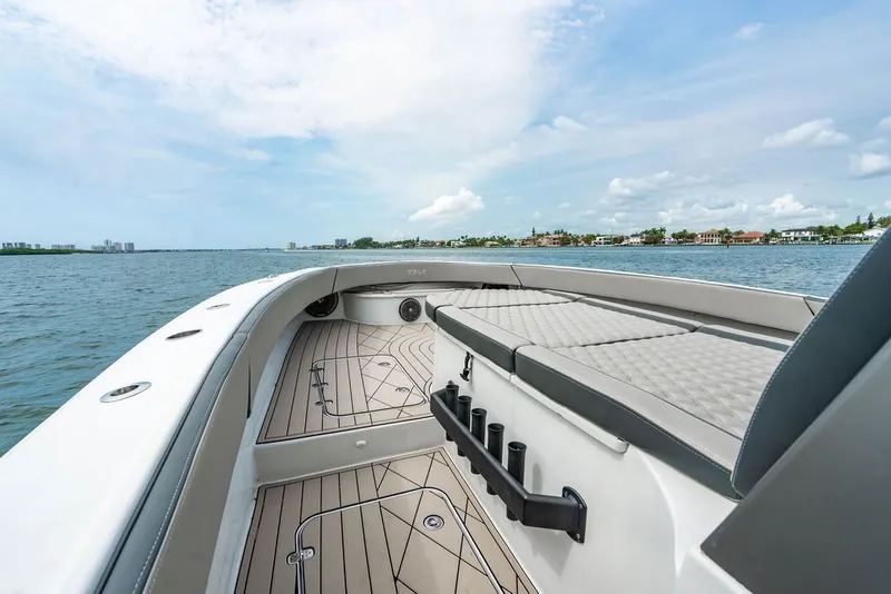 Slide: The Image of Custom 368 Center Console 2021 on the water with spacious deck. - 31