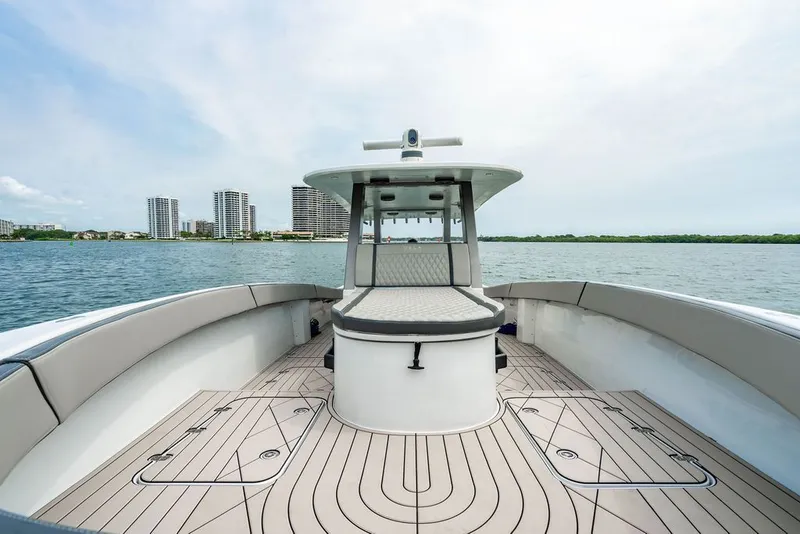 Slide: The Image of Custom 368 Center Console 2021 on calm water with cityscape in the background. - 33