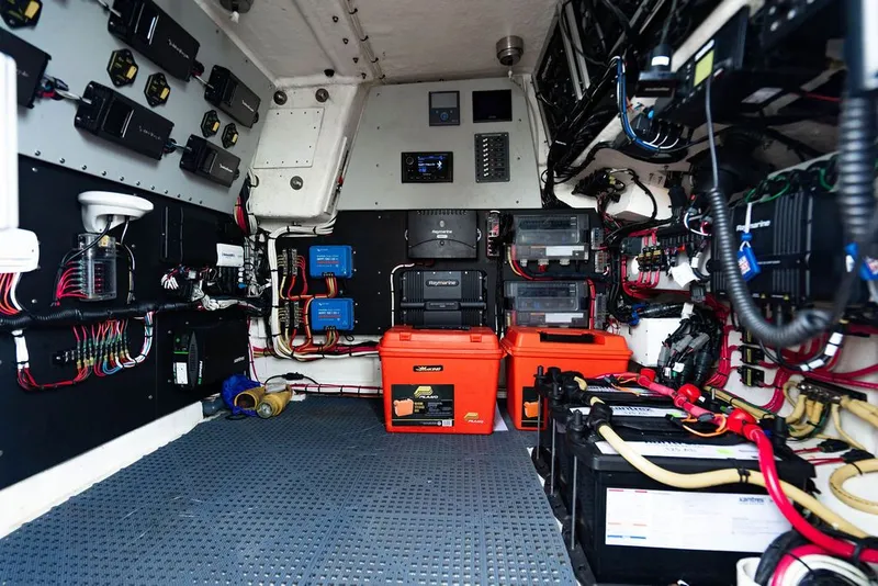 Slide: The Image of Electronics and battery room of a boat with wiring and equipment. - 41