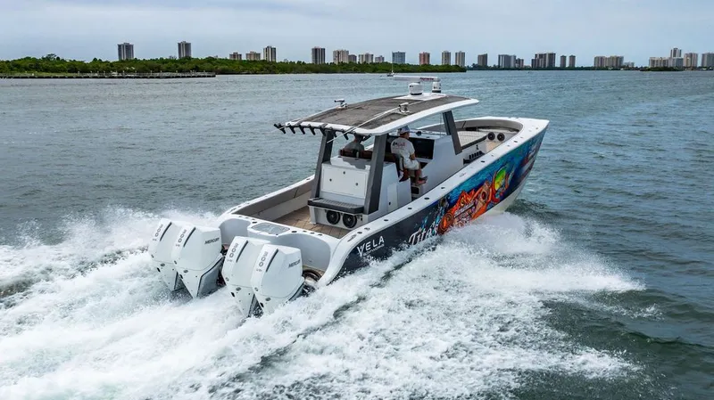 Slide: The Image of Custom 368 Center Console 2021 on the water with twin outboard engines. - 7