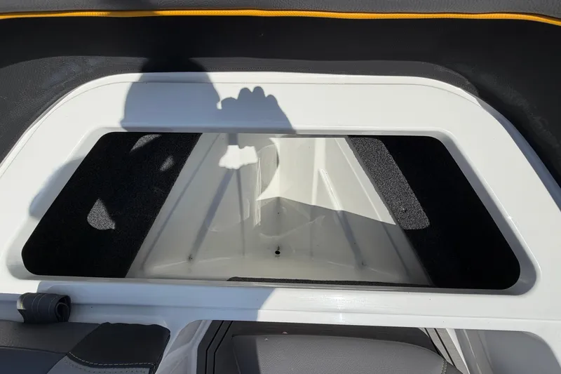 Slide: The Image of Storage compartment inside a 2021 Cobalt R8 Surf boat. - 14