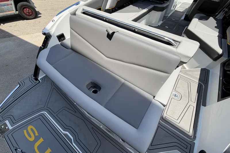 Slide: The Image of 2021 Cobalt R8 Surf boat interior with gray seating and deck details. - 20