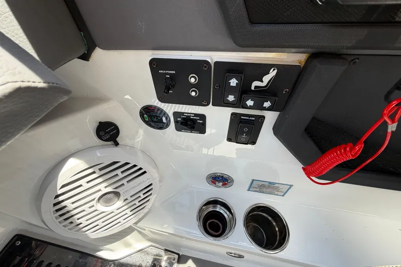 Slide: The Image of Control panel of 2021 Cobalt R8 Surf boat with speaker and switches. - 22