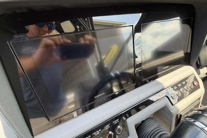 Slide: The Image of Dashboard of a 2021 Cobalt R8 Surf boat with Garmin displays. - 23