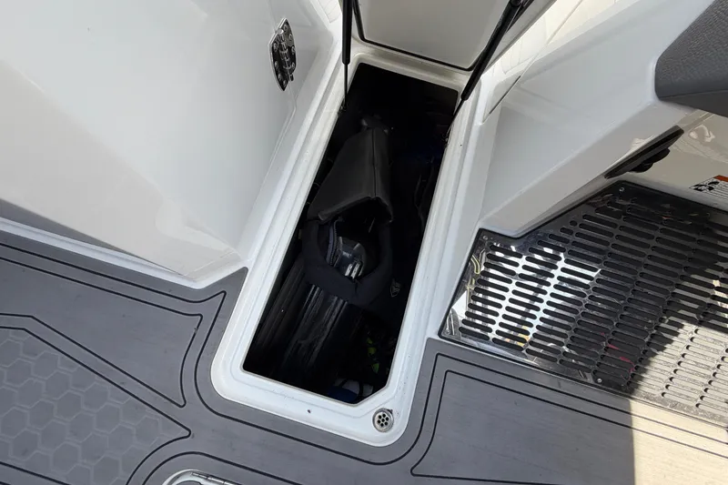 Slide: The Image of Storage compartment in Cobalt R8 Surf boat with equipment. - 25
