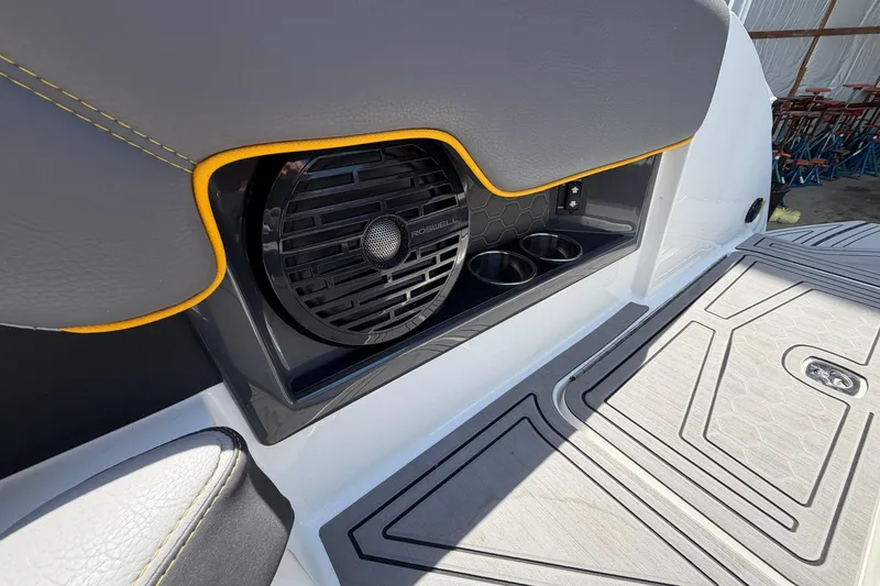 Slide: The Image of 2021 Cobalt R8 Surf boat interior with speaker and cup holders. - 27