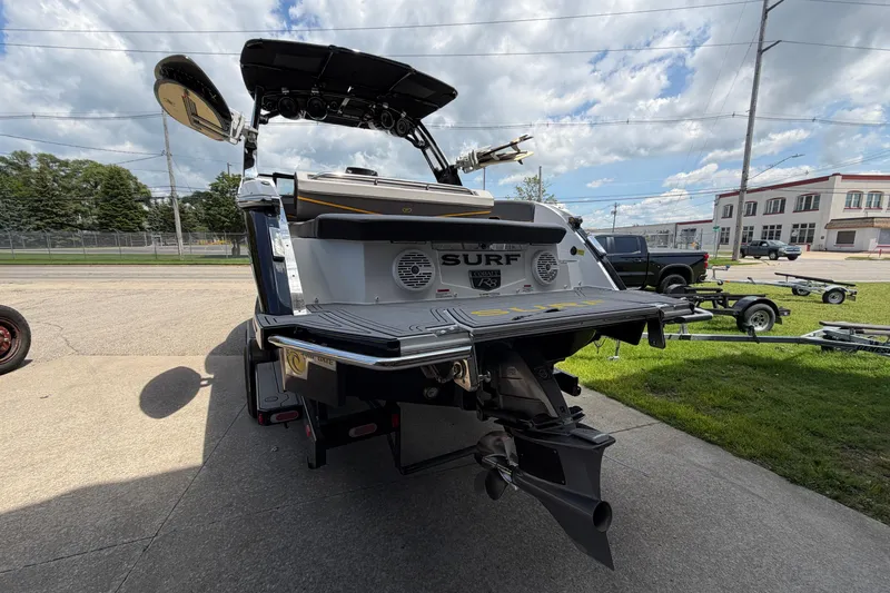 Slide: The Image of 2021 Cobalt R8 Surf boat rear view, showcasing sleek design and advanced features. - 32