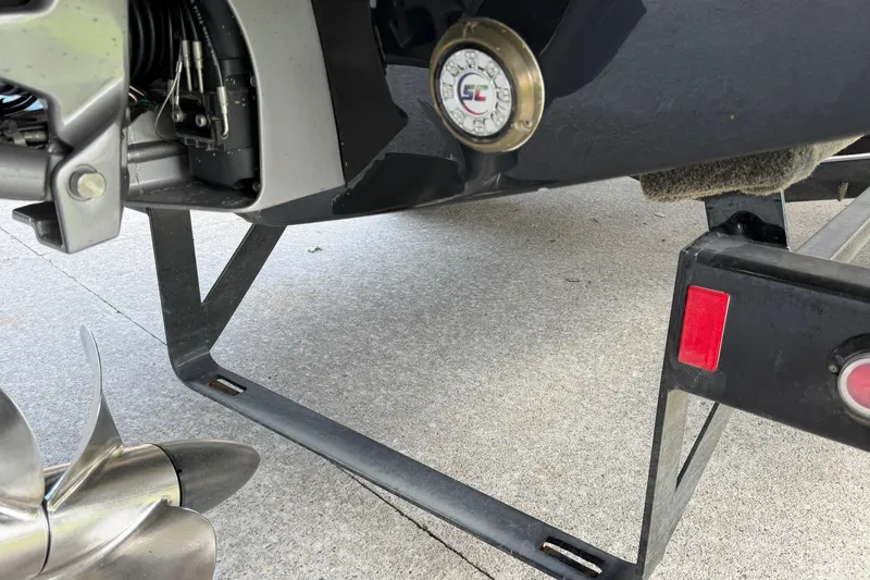 Slide: The Image of Close-up of a 2021 Cobalt R8 Surf boat's propeller and trailer detail. - 35