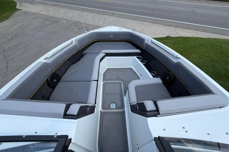 Slide: The Image of 2021 Cobalt R8 Surf boat interior with sleek gray seating and modern design. - 4