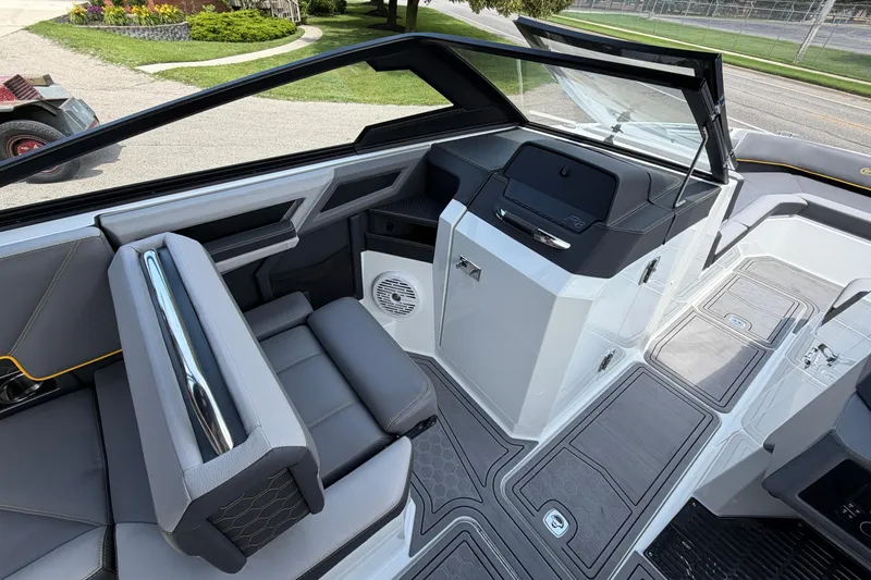 Slide: The Image of 2021 Cobalt R8 Surf boat interior with sleek seating and modern dashboard design. - 5
