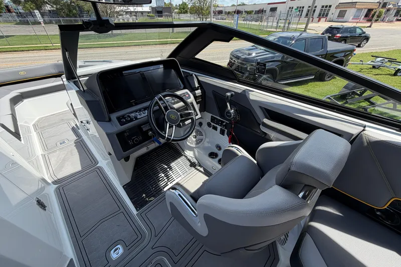 Slide: The Image of Interior of a 2021 Cobalt R8 Surf boat with modern dashboard and seating. - 8
