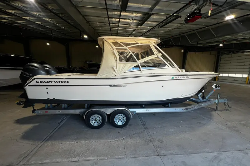 The Image of 2014 Grady-White Freedom 275 boat on trailer in indoor storage facility. - 0