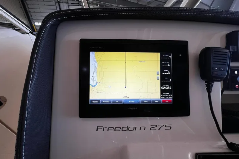 Slide: The Image of Garmin GPS display on 2014 Grady-White Freedom 275 boat dashboard. - 13