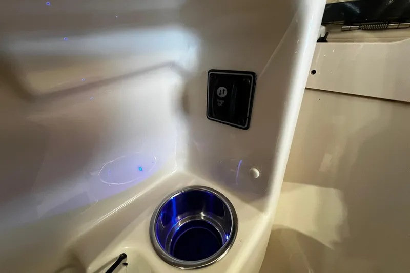 Slide: The Image of Interior of 2014 Grady-White Freedom 275 boat with cup holder and power outlet. - 20