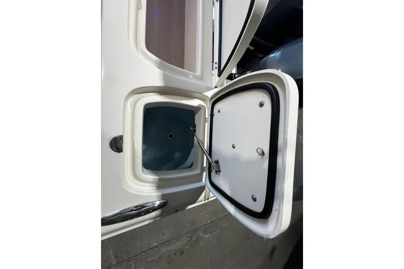 Slide: The Image of Open storage compartment on 2014 Grady-White Freedom 275 boat. - 26