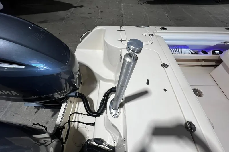 Slide: The Image of 2014 Grady-White Freedom 275 boat stern with Yamaha engine and fishing rod holder. - 31