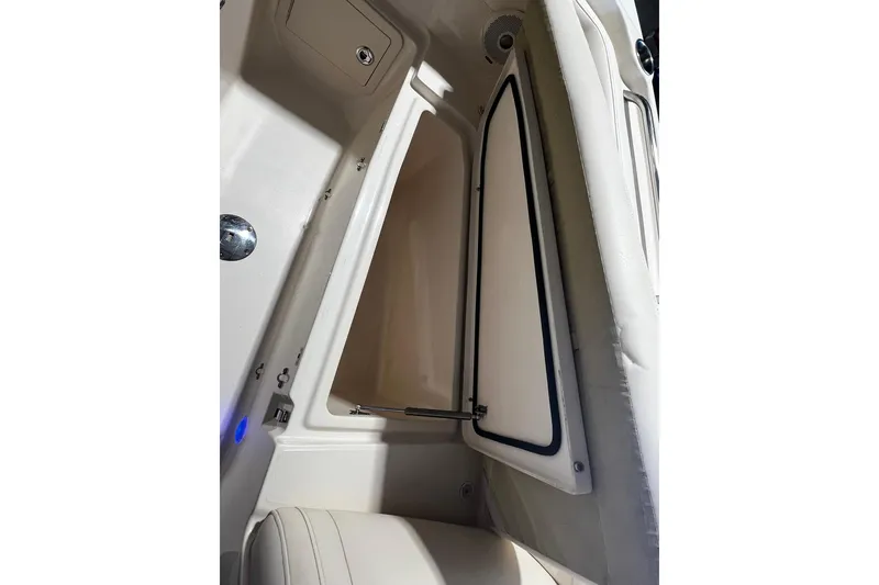 Slide: The Image of 2014 Grady-White Freedom 275 boat interior storage compartment with open hatch. - 5