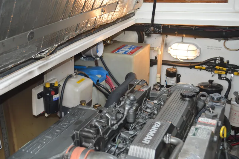 Slide: The Image of Engine room of 2003 Legacy 28 Express boat with Yanmar engine components. - 15