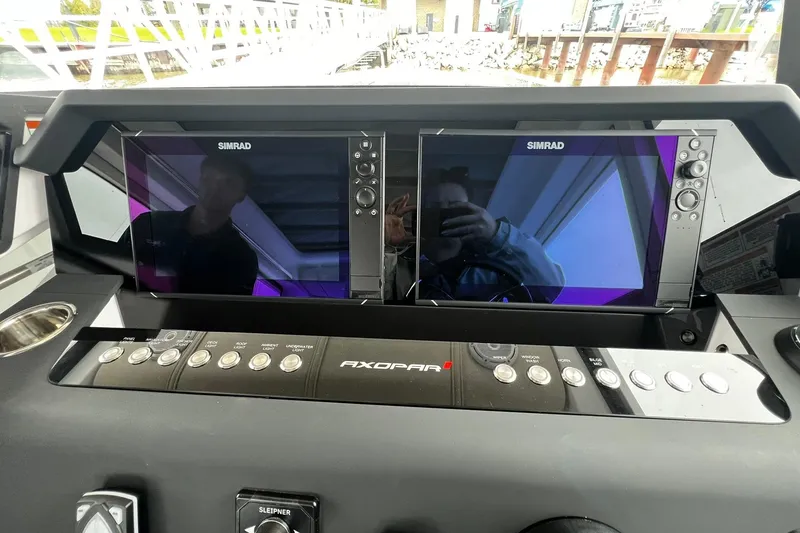 Slide: The Image of Helm of 2025 Axopar 37 XC Cross Cabin with dual Simrad displays. - 11