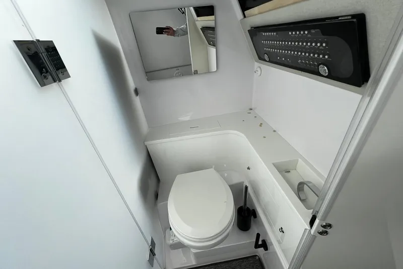 Slide: The Image of 2025 Axopar 37 XC Cross Cabin bathroom with modern fixtures and sleek design. - 19