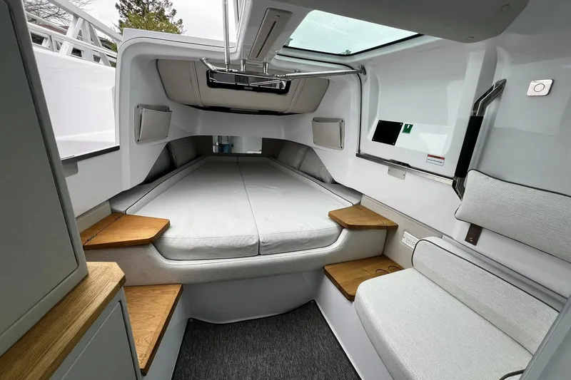 Slide: The Image of 2025 Axopar 37 XC Cross Cabin interior with modern design and comfortable seating. - 20