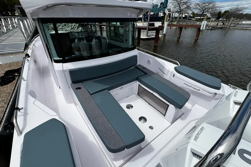 Slide: The Image of 2025 Axopar 37 XC Cross Cabin boat with spacious seating area and modern design. - 6