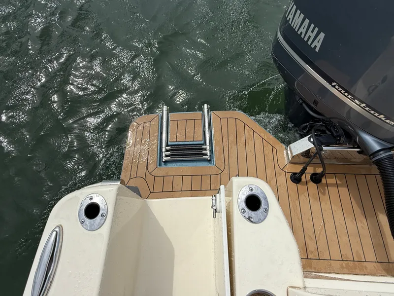 Slide: The Image of The 2020 Scout 235 XSF features a teak deck and a Yamaha motor mount. - 8