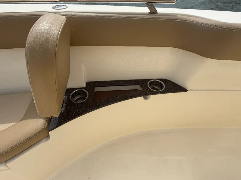 Slide: The Image of Close-up of a boat seat with two cup holders and a storage area. - 18