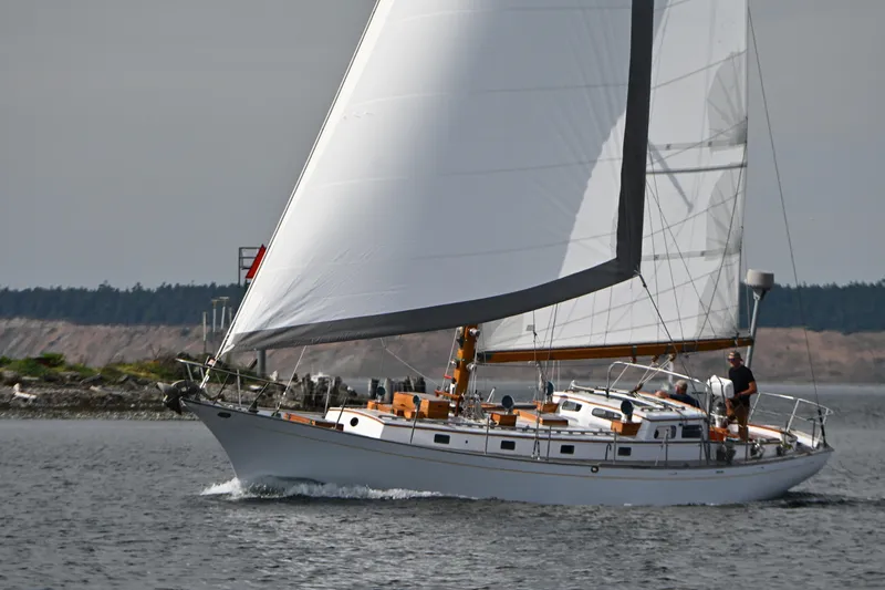 Slide: The Image of Sailing yacht Rhodes 50 from 1963 gliding on calm waters. - 4