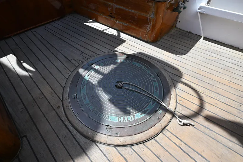 Slide: The Image of Deck of 1963 Rhodes 50 Cutter with circular hatch and rope detail. - 42