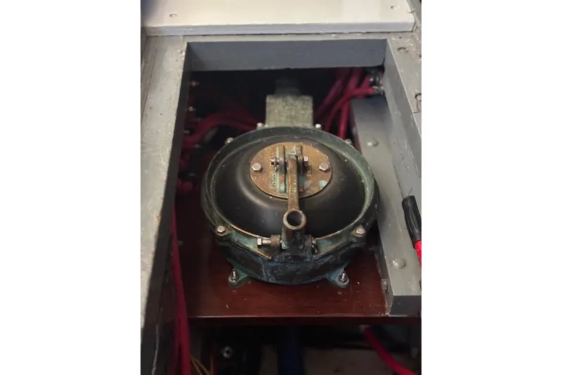 Slide: The Image of 1963 Rhodes 50 engine compartment with vintage mechanical component and wiring. - 41