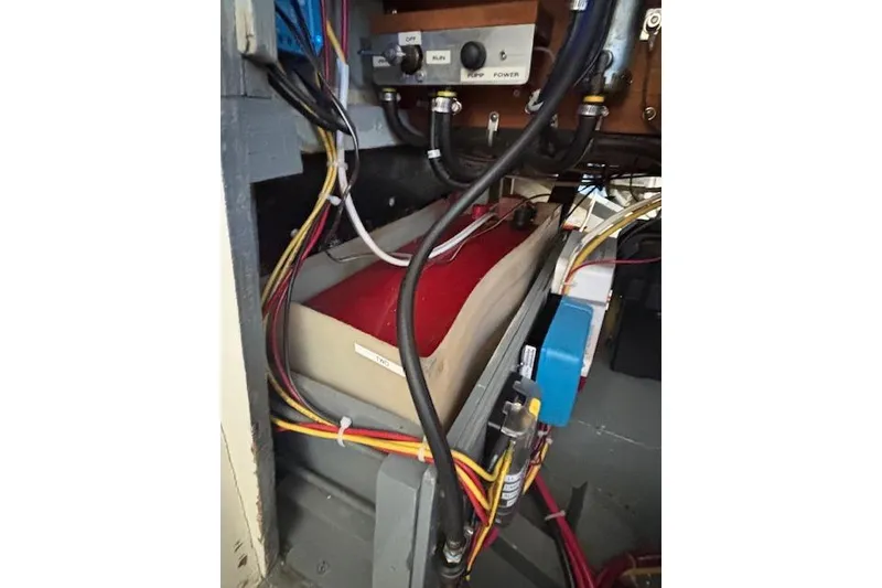 Slide: The Image of Electrical wiring and components inside a 1963 Rhodes 50 Cutter boat. - 47