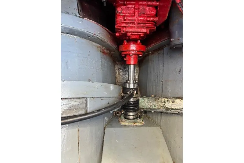 Slide: The Image of Close-up of a 1963 Rhodes 50 mechanical component with red and gray parts. - 44