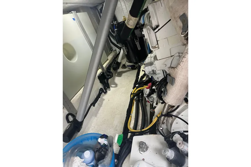 Slide: The Image of Engine room of a 2018 Back Cove 41 boat, showing mechanical components and wiring. - 22