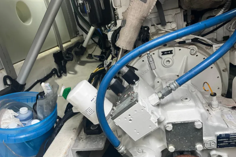 Slide: The Image of Engine room of a 2018 Back Cove 41 boat with visible components and maintenance supplies. - 20
