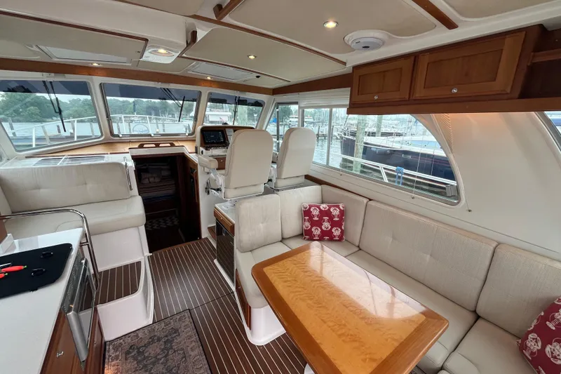 Slide: The Image of Luxurious interior of 2018 Back Cove 41 yacht with elegant seating and wooden accents. - 7