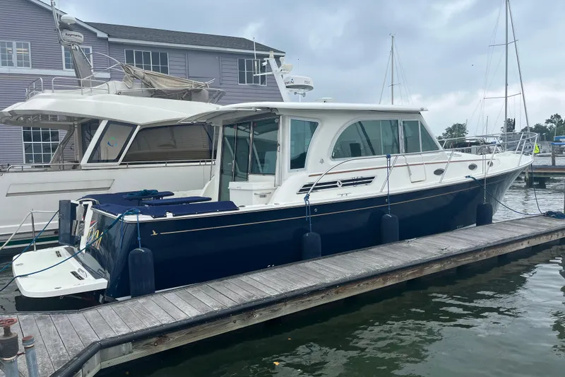 The Image of 2018 Back Cove 41 yacht docked at marina, overcast sky. - 1