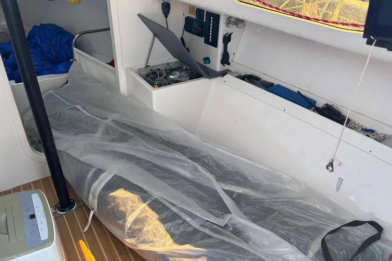 Slide: The Image of Interior of a 2015 J Boats J/88 sailboat, featuring equipment and storage areas. - 22