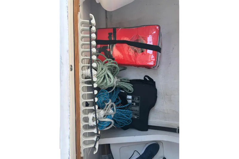 Slide: The Image of Storage compartment of a 2015 J Boats J/88 with ropes and safety gear. - 29