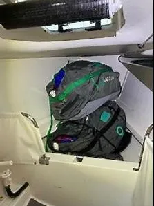 Slide: The Image of Interior of a boat with two stacked sail bags. - 15