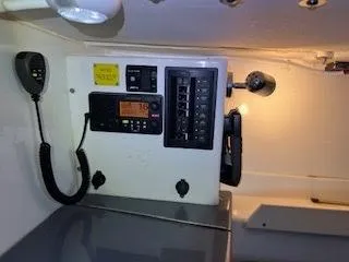 Slide: The Image of Electronics and control panel inside a boat, featuring a radio and switches. - 17