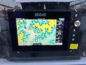 Slide: The Image of A B&G navigation system displaying a map with waterways and depths. - 8