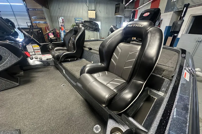Slide: The Image of Interior of a 2018 Nitro Z20 Pro boat featuring sleek black leather seats. - 13