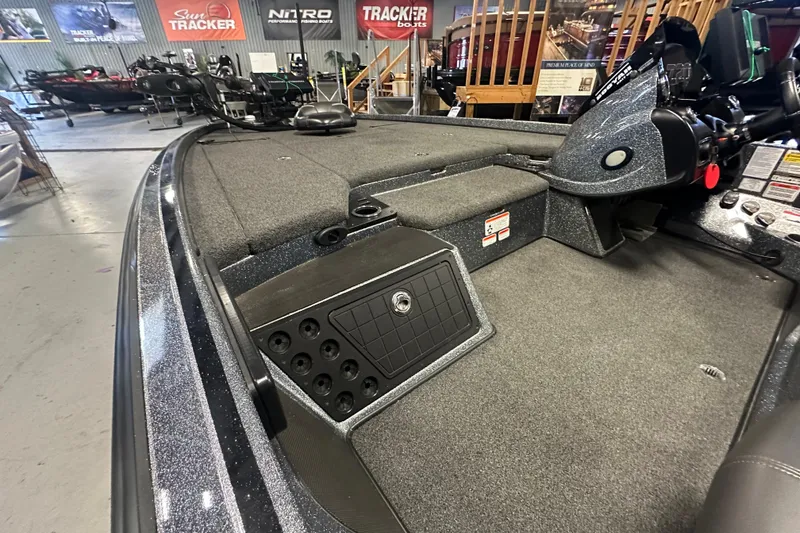 Slide: The Image of 2018 Nitro Z20 Pro fishing boat interior with carpeted deck and storage compartments. - 14
