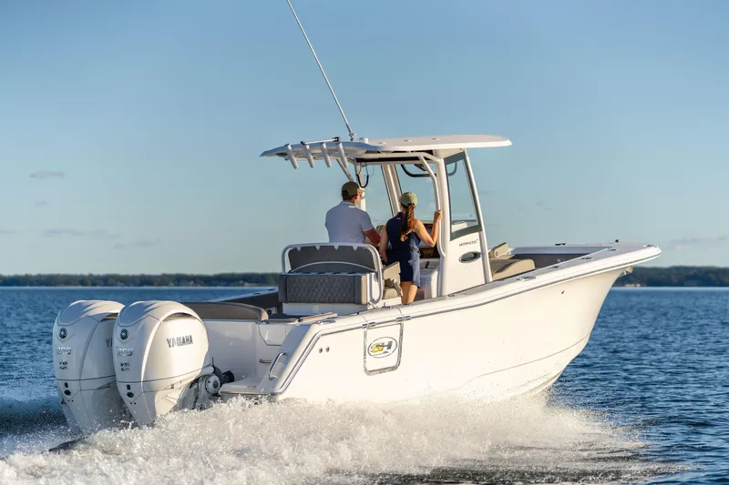 Slide: The Image of 2026 Sea Hunt Ultra 275 Coffin Box boat cruising on open water. - 6