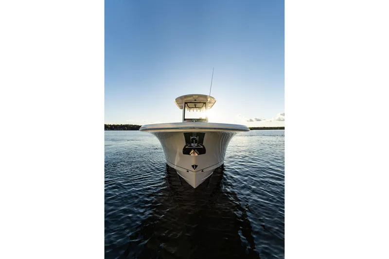 Slide: The Image of Front view of 2026 Sea Hunt Ultra 275 Coffin Box boat on calm water. - 42