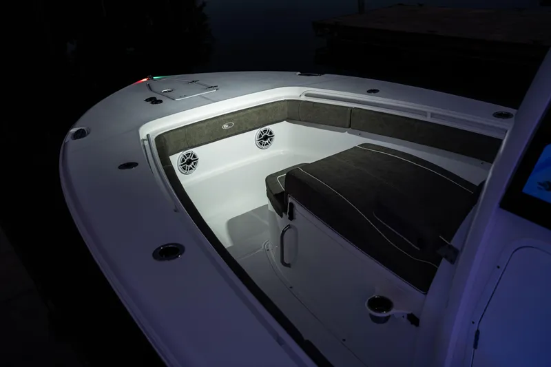 Slide: The Image of 2026 Sea Hunt Ultra 275 Coffin Box boat interior with cushioned seating and speakers. - 15